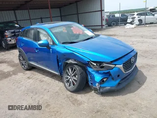 2016 Mazda CX-3 Grand Touring z VIN JM1DKFD78G0134173, wystawiony jako IAAI lot #42179942 z przebiegiem 93 539 mil mil oraz . Historia ofert i sprzedaży dostępna na DreamBid. Obrazek 1.