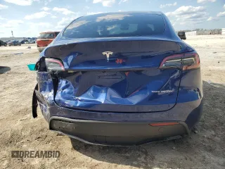 2023 Tesla Model Y Long Range z VIN 7SAYGDEE3PA178832, wystawiony jako Copart lot #57156005 z przebiegiem 12 920 mil mil oraz Szkody całkowita. Historia ofert i sprzedaży dostępna na DreamBid. Obrazek 6.