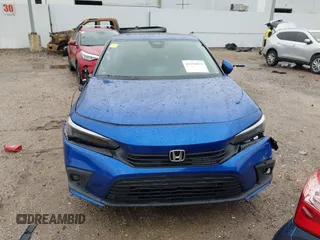2023 Honda Civic Touring z VIN 2HGFE1F92PH317695, wystawiony jako IAAI lot #41556915 z przebiegiem 20 421 mil mil oraz . Historia ofert i sprzedaży dostępna na DreamBid. Obrazek 13.