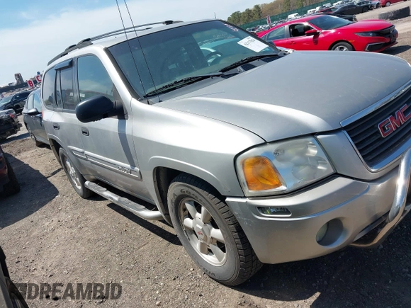 2004 GMC Envoy SLE with VIN 1GKDT13S042113411, listed as a IAAI auction lot 42117824 with 116,827 mi miles. Bid and sale history available at carsss.com. Image 1.