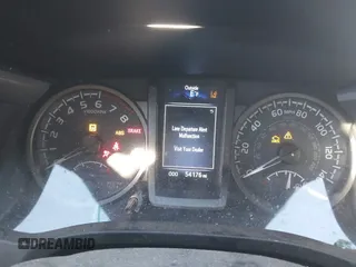 2021 Toyota Tacoma SR with VIN 3TYCZ5AN2MT039450, listed as a IAAI auction lot 40457613 with 54,176 mi miles and . Bid and sale history available at DreamBid. Image 7.