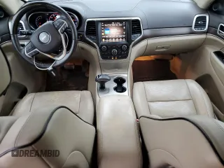 2014 Jeep Grand Cherokee Overland with VIN 1C4RJFCG9EC572237, listed as a Copart auction lot 53864865 with 90,657 mi miles and Salvage Title. Bid and sale history available at DreamBid. Image 8.