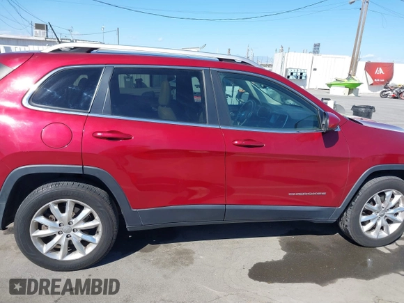 2015 Jeep Cherokee Limited with VIN 1C4PJMDB1FW599205, listed as a IAAI auction lot 41709308 with 112,415 mi miles. Bid and sale history available at carsss.com. Image 13.