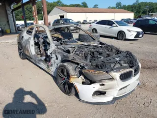 2016 BMW M6 with VIN WBS6J9C52GD934529, listed as a IAAI auction lot 40177964 with 51,664 mi miles. Bid and sale history available at carsss.com. Image 1.