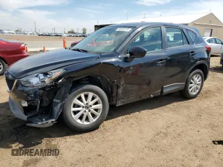 2014 Mazda CX-5 Sport with VIN JM3KE2BE0E0335126, listed as a Copart auction lot 56555315 with 116,718 mi miles and Salvage title. Bid and sale history available at DreamBid. Image 1.