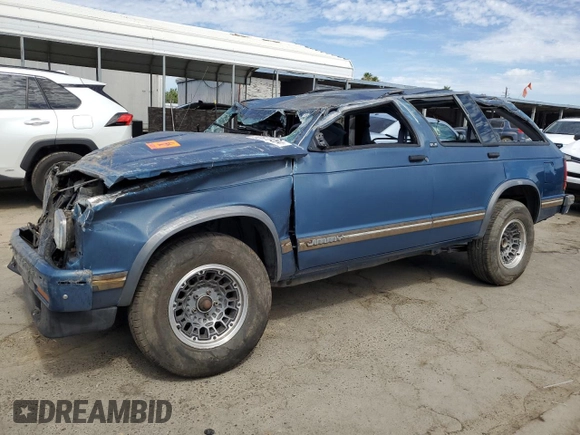 1994 GMC Jimmy SL z VIN 1GKCS13WXR0532905, wystawiony jako Copart lot #60670404 z przebiegiem 116 002 mil mil oraz Nie do naprawy. Historia ofert i sprzedaży dostępna na DreamBid. Obrazek 1.
