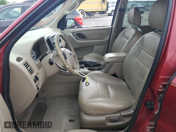 2005 Ford Escape Limited with VIN 1FMYU04165KA33277, listed as a Copart auction lot 54407625 with 217,317 mi miles and Salvage title. Bid and sale history available at DreamBid. Image 7.
