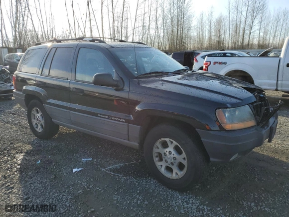 1999 Jeep Grand Cherokee Laredo with VIN 1J4GW58N1XC737706, listed as a Copart auction lot 83107914 with 0 mi miles and Salvage Title. Bid and sale history available at carsss.com. Image 4.