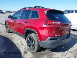 2017 Jeep Cherokee Altitude with VIN 1C4PJLABXHW661153, listed as a IAAI auction lot 41058821 with 167,418 mi miles and . Bid and sale history available at DreamBid. Image 3.