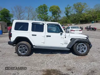 2019 Jeep Wrangler Unlimited Sahara with VIN 1C4HJXEN5KW509806, listed as a IAAI auction lot 42071325 with 95,549 mi miles and . Bid and sale history available at DreamBid. Image 14.