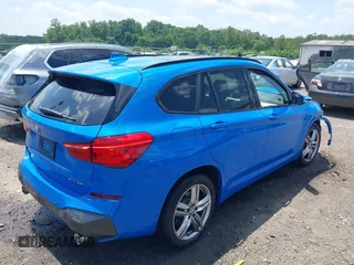 2021 BMW X1 xDrive28i with VIN WBXJG9C04M5T61811, listed as a IAAI auction lot 42509852 with 30,400 mi miles and . Bid and sale history available at DreamBid. Image 4.
