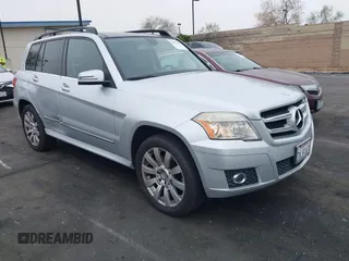 2012 Mercedes-Benz GLK with VIN WDCGG5GB0CF892387, listed as a IAAI auction lot 42031687 with 123,587 mi miles. Bid and sale history available at carsss.com. Image 1.