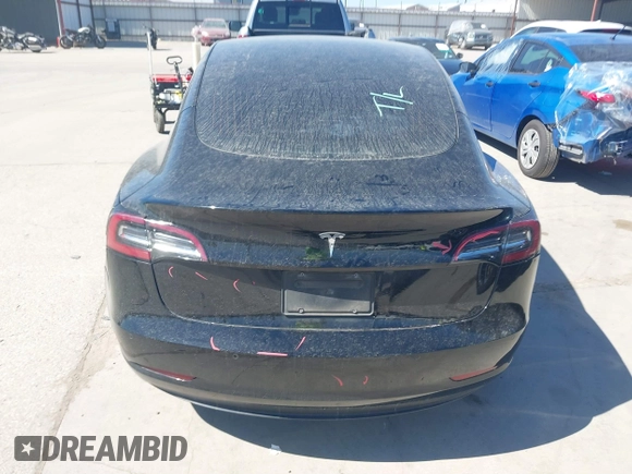 2020 Tesla Model 3 Standard Range Plus with VIN 5YJ3E1EAXLF614002, listed as a IAAI auction lot 41758898 with 42,363 mi miles and . Bid and sale history available at DreamBid. Image 16.