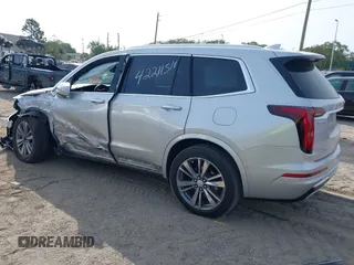 2020 Cadillac XT6 FWD Premium Luxury z VIN 1GYKPCRSXLZ136057, wystawiony jako IAAI lot #42211514 z przebiegiem 32 476 mil mil oraz . Historia ofert i sprzedaży dostępna na DreamBid. Obrazek 3.