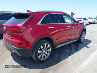 2021 Cadillac XT4 FWD Premium Luxury z VIN 1GYFZCR48MF004849, wystawiony jako IAAI lot #42131896 z przebiegiem 9 864 mil mil oraz . Historia ofert i sprzedaży dostępna na DreamBid. Obrazek 4.