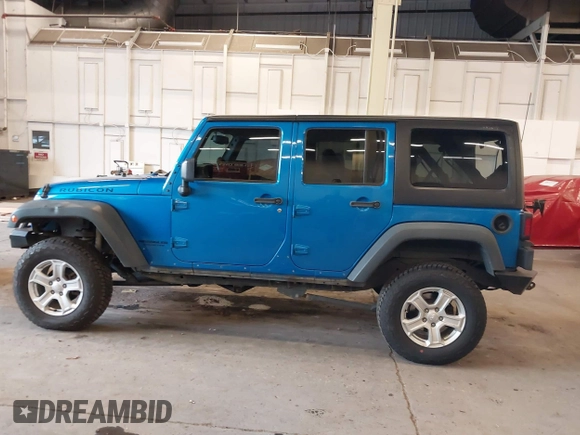 2015 Jeep Wrangler Unlimited Rubicon with VIN 1C4BJWFG7FL661643, listed as a IAAI auction lot 41291385 with 112,785 mi miles. Bid and sale history available at carsss.com. Image 15.