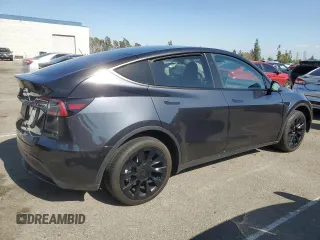 2024 Tesla Model Y with VIN 7SAYGDED7RF056973, listed as a Copart auction lot 55310705 with 15,391 mi miles and Salvage Title. Bid and sale history available at DreamBid. Image 3.