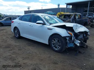 2019 Kia Optima LX with VIN 5XXGT4L35KG293379, listed as a IAAI auction lot 40745281 with 80,927 mi miles. Bid and sale history available at carsss.com. Image 1.
