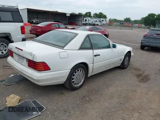 1997 Mercedes-Benz SL 500 z VIN WDBFA63F0VF146394, wystawiony jako IAAI lot #42308697 z przebiegiem 106 935 mil mil oraz . Historia ofert i sprzedaży dostępna na DreamBid. Obrazek 4.