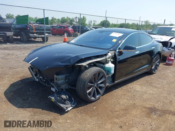 2013 Tesla Model S Performance with VIN 5YJSA1CP5DFP25346, listed as a IAAI auction lot 42463047 with 112,909 mi miles and . Bid and sale history available at DreamBid. Image 2.
