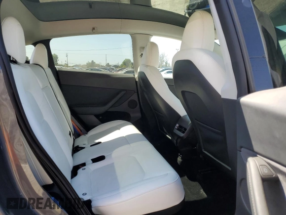2023 Tesla Model Y Performance with VIN 7SAYGDEF0PF915030, listed as a Copart auction lot 50159375 with 19,772 mi miles and Salvage Title. Bid and sale history available at DreamBid. Image 11.