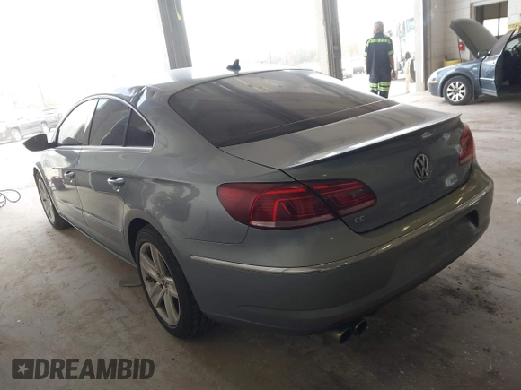 2013 Volkswagen CC Sport with VIN WVWBP7AN1DE567561, listed as a IAAI auction lot 42174906 with 157,827 mi miles. Bid and sale history available at carsss.com. Image 3.
