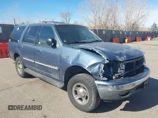 1999 Ford Expedition XLT z VIN 1FMPU18L2XLB43236, wystawiony jako IAAI lot #41792317 z przebiegiem 157 636 mil mil oraz . Historia ofert i sprzedaży dostępna na DreamBid. Obrazek 1.