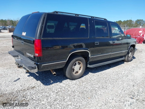 1999 Chevrolet Suburban with VIN 3GNEC16R0XG137834, listed as a IAAI auction lot 41853492 with 296,147 mi miles. Bid and sale history available at carsss.com. Image 4.