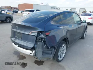 2023 Tesla Model Y Long Range with VIN 7SAYGDEEXPA078629, listed as a IAAI auction lot 42046354 with 27,245 mi miles and . Bid and sale history available at DreamBid. Image 4.