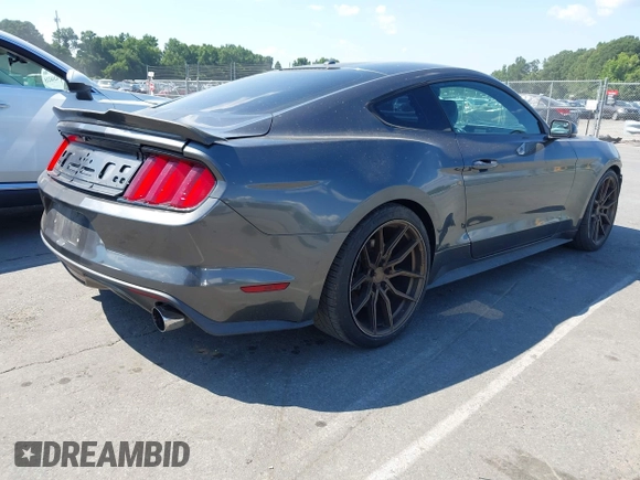 2015 Ford Mustang EcoBoost with VIN 1FA6P8TH8F5394953, listed as a IAAI auction lot 42618352 with 101,302 mi miles and . Bid and sale history available at DreamBid. Image 4.
