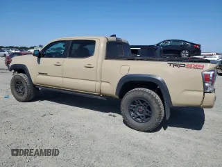 2020 Toyota Tacoma SR5 with VIN 3TMDZ5BN3LM087312, listed as a Copart auction lot 57876405 with 49,201 mi miles and Salvage title. Bid and sale history available at DreamBid. Image 2.