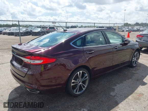2017 Ford Fusion Titanium with VIN 3FA6P0K97HR214485, listed as a IAAI auction lot 40208619 with 39,265 mi miles and . Bid and sale history available at DreamBid. Image 4.