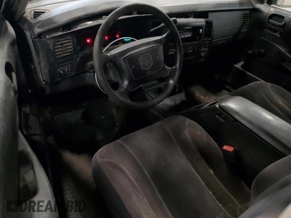 2003 Dodge Dakota z VIN 1D7GG16X23S204317, wystawiony jako Copart lot #54830745 z przebiegiem 139 508 mil mil oraz Szkoda całkowita • Salvage title. Historia ofert i sprzedaży dostępna na DreamBid. Obrazek 8.