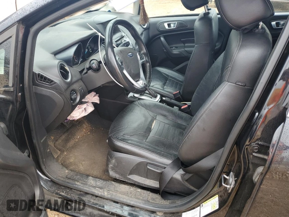 2014 Ford Fiesta Titanium z VIN 3FADP4FJ9EM110690, wystawiony jako Copart lot #48338625 z przebiegiem 175 441 mil mil oraz Szkoda całkowita • Salvage title. Historia ofert i sprzedaży dostępna na DreamBid. Obrazek 7.