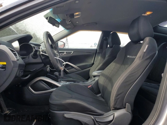 2012 Hyundai Veloster w/Black Int z VIN KMHTC6ADXCU025876, wystawiony jako Copart lot #50377835 z przebiegiem 185 181 mil mil oraz Czysty tytuł • Clean title. Historia ofert i sprzedaży dostępna na DreamBid. Obrazek 7.