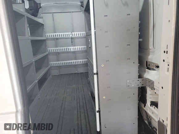 2023 Ford Transit Cargo с VIN 1FTBR1X89PKA75830, выставлен на аукционе IAAI как лот 42907933 с пробегом 17 668 миль миль и . История ставок и продаж доступна на DreamBid. Изображение 19.