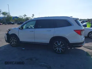 2019 Honda Pilot Touring 8-Passenger z VIN 5FNYF6H98KB016992, wystawiony jako IAAI lot #42275295 z przebiegiem 82 154 mil mil oraz . Historia ofert i sprzedaży dostępna na DreamBid. Obrazek 14.