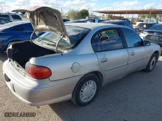 2004 Chevrolet Classic with VIN 1G1ND52F34M589464, listed as a IAAI auction lot 41566346 with 128,084 mi miles. Bid and sale history available at carsss.com. Image 4.