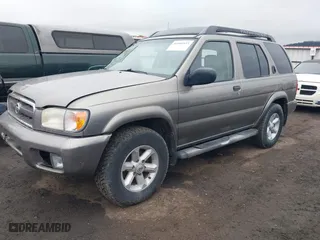 2004 Nissan Pathfinder SE with VIN JN8DR09Y84W903472, listed as a IAAI auction lot 41906953 with 229,758 mi miles. Bid and sale history available at carsss.com. Image 2.