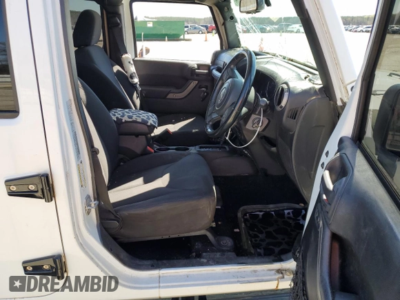 2015 Jeep Wrangler Unlimited Sport RHD with VIN 1C4BJWKG0FL690763, listed as a Copart auction lot 48823714 with 156,714 mi miles and Salvage title. Bid and sale history available at DreamBid. Image 7.