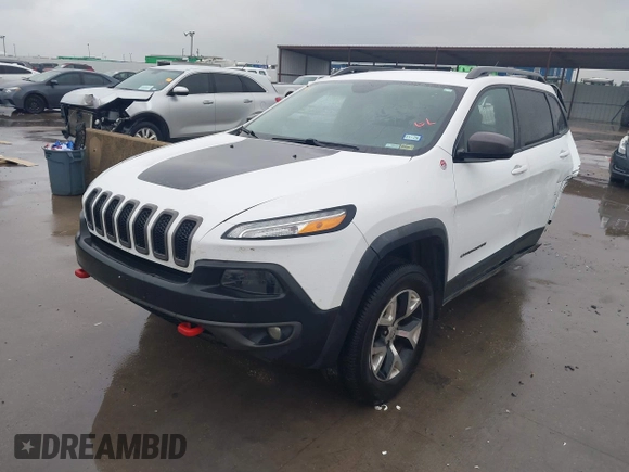 2015 Jeep Cherokee Trailhawk with VIN 1C4PJMBB1FW630519, listed as a IAAI auction lot 41605466 with 219,390 mi miles and . Bid and sale history available at carsss.com. Image 18.