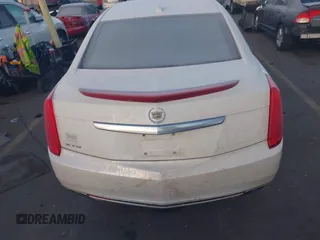 2014 Cadillac XTS Premium with VIN 2G61P5S30E9123057, listed as a IAAI auction lot 41301457 with 123,042 mi miles and . Bid and sale history available at DreamBid. Image 16.