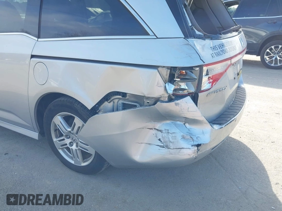 2012 Honda Odyssey Touring with VIN 5FNRL5H95CB063003, listed as a IAAI auction lot 41871975 with 179,332 mi miles and . Bid and sale history available at DreamBid. Image 6.
