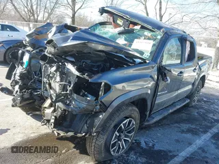 2023 Toyota Tacoma SR with VIN 3TMCZ5AN9PM574534, listed as a IAAI auction lot 41167910 with 27,375 mi miles and . Bid and sale history available at DreamBid. Image 2.