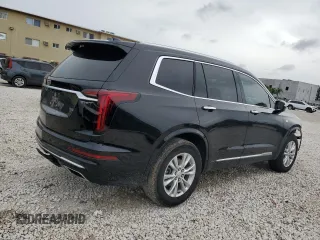 2024 Cadillac XT6 FWD Luxury z VIN 1GYKPAR41RZ734536, wystawiony jako Copart lot #46669655 z przebiegiem 11 916 mil mil oraz Szkoda całkowita • Salvage title. Historia ofert i sprzedaży dostępna na DreamBid. Obrazek 3.