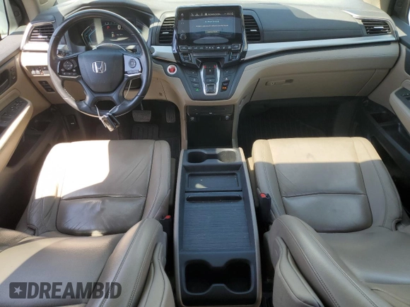 2018 Honda Odyssey Touring with VIN 5FNRL6H8XJB018438, listed as a Copart auction lot 61876505 with 104,581 mi miles and Salvage title. Bid and sale history available at DreamBid. Image 8.