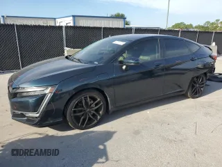 2018 Honda Clarity Touring z VIN JHMZC5F34JC005746, wystawiony jako Copart lot #62731775 z przebiegiem 97 743 mil mil oraz Szkoda całkowita • Salvage title. Historia ofert i sprzedaży dostępna na DreamBid. Obrazek 1.