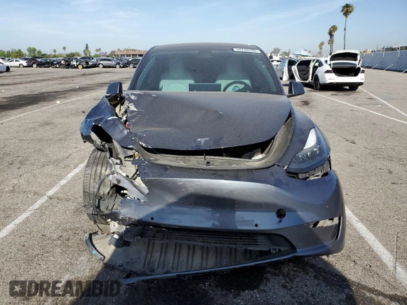 2022 Tesla Model Y Performance z VIN 7SAYGDEF1NF405329, wystawiony jako Copart lot #57249195 z przebiegiem 62 423 mil mil oraz Szkoda całkowita • Salvage title. Historia ofert i sprzedaży dostępna na DreamBid. Obrazek 5.