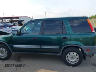 1999 Honda CR-V LX z VIN JHLRD2848XC015999, wystawiony jako IAAI lot #42150718 z przebiegiem 161 389 mil mil oraz . Historia ofert i sprzedaży dostępna na DreamBid. Obrazek 14.