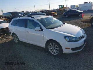 2014 Volkswagen Jetta SportWagen TDI with VIN 3VWPL7AJ4EM601001, listed as a IAAI auction lot 41673953 with 118,644 mi miles. Bid and sale history available at carsss.com. Image 1.